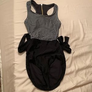 AlbionFit black and white checkered one piece. Open back with adjustable tie